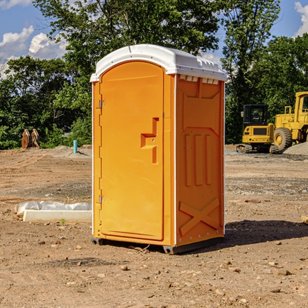 what is the cost difference between standard and deluxe portable toilet rentals in Yates Center